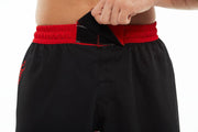 Front View of man wearing black and red Fighters Choice Everlasting Fight Shorts, the apparel elite fighters use to look sharp on the BJJ mat