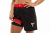 Front View of woman wearing her black and red Fighters Choice Everlasting Fight Shorts, with the Fighters Choice logo on the left leg pant, the apparel elite fighters use to perform and look sharp on the BJJ mat