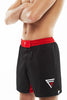 Left View of Man wearing black and red Fighters Choice Everlasting Fight Shorts, with the Fighters Choice logo on the left right pant, the best shorts to look sharp on the BJJ mat