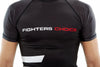 Man wearing black Fighters Choice Takeover Short Sleeve Rashguard, with the Fighters Choice name prominently displayed in the front, the best apparel for Gi/NoGi fighters