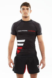 Man wearing black Fighters Choice Takeover Short Sleeve Rashguard, with the Fighters Choice name and logo on the front, the best apparel for Gi/NoGi BJJ fighters