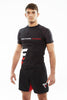 Man wearing black Fighters Choice Takeover Short Sleeve Rashguard, with the Fighters Choice name on the front, the best apparel for Gi/NoGi BJJ fighters