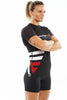 Woman, with arms crossed at the front, wearing black Fighters Choice Takeover Short Sleeve Rashguard, the best rashguard for both men and women, Gi/NoGi BJJ fighters