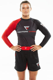 Woman with hands on waist, wearing Fighters Choice Gi/NoGi Bloody Arm Long Sleeve Rashguard for Men, Women and BJJ Fighters