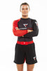 Woman with crossed arms, wearing Fighters Choice Gi/NoGi Bloody Arm Long Sleeve Rashguard for Men, Women and BJJ Fighters